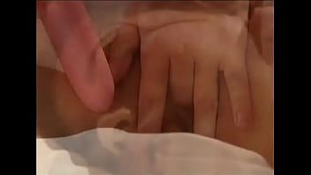Play Girl with big breasts surrounded by several men who are masturbating and whose dicks she sucks
